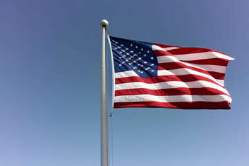 Fototapeta premium American Flag Waving in the Wind