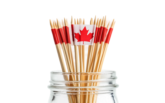 Glass jar containing mini Canadian flag toothpicks, a cute and patriotic decoration for events isolated on white background PNG