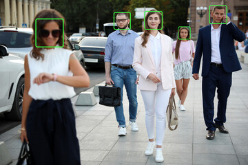 Facial recognition system identifying people on city street, selective focus