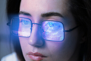 Stock exchange. Trader analyzing data, closeup. Graphs reflecting in her eyeglasses