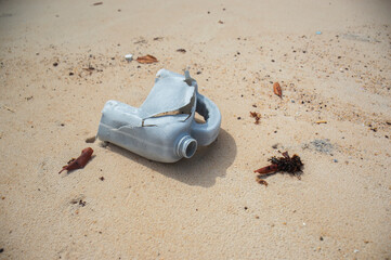 Plastic pollution on sandy beach in Brazil raises environmental concern. Praia das Minas, Pipa, Brazil.