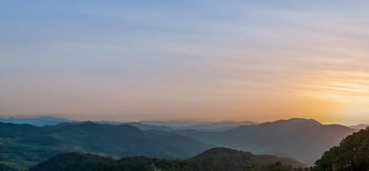 Fototapeta premium Beautiful sunset in mountains at twilight evening sky