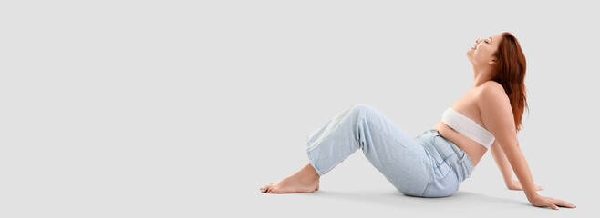 Beautiful plus size woman on light background with space for text