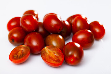 Fresh juicy organic cherry tomatoes on wooden table
