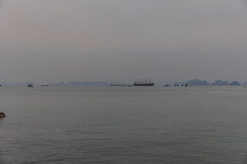 Halong Ha Long Bay Hanoi this Vietnamese wonder is littered with mountains and Rock cliffs popping out of the ocean, lush green mountains in Vietnam