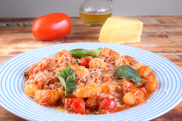 Gnocchi with red Bolognese sauce, typical Italian pasta potato food taste
