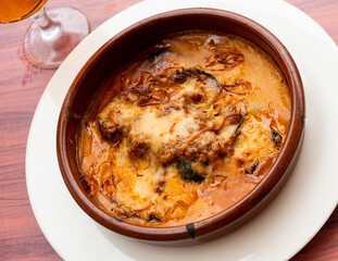 Appetizing Egyptian moussaka made from layers of fried eggplant in tomato sauce and spicy ground beef sprinkled with cheese and baked in clay bowl