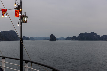 Halong Ha Long Bay Hanoi this Vietnamese wonder is littered with mountains and Rock cliffs popping out of the ocean, lush green mountains in Vietnam