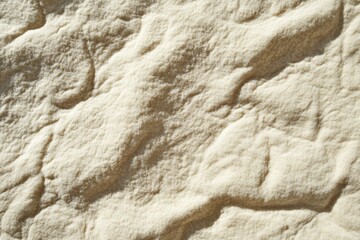 Fine, pale-beige powder texture