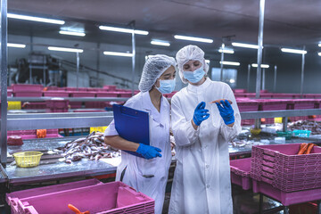 Food and manufacturing researchers oversee seafood production lines in tightly controlled factories...