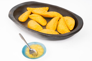 Colombian empanada with spicy sauce 