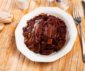 Stewed red cabbage with pork ribs on plate