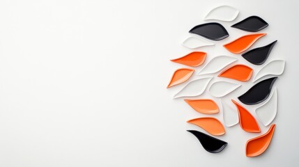 Colorful Ceramic Leaves Arranged on a White Background