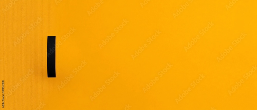 Poster black, vertical, rectangular object on a vibrant yellow background. simple design