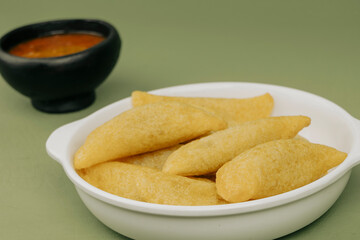 Delicious traditional Colombian empanadas with spicy sauce