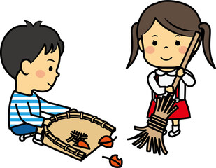 落ち葉を片付ける小学生男女