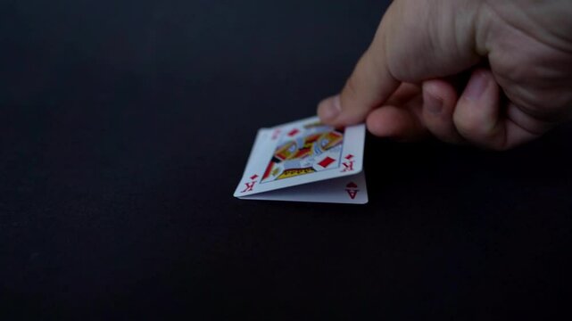 Close-up video showing the perfect poker hand: a royal straight flush laid out on the table. Ace-high hearts in a clean, dramatic reveal &ndash; the ultimate winning combination.