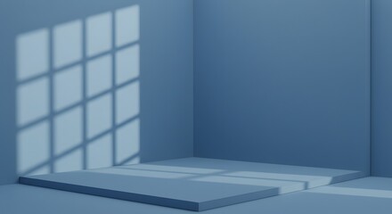A minimalist blue room with window light casting shadows on the walls and platform surfaces