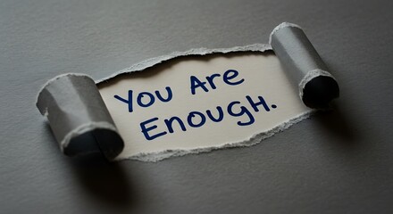 Inspirational Message: You Are Enough handwritten in blue ink.