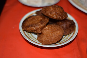 Traditional Sri Lankan New Year Sweet Kevum Display. Sri Lankan Avurudu Kevum. Cultural New Year Treats on a Traditional Food kewm plate. konda keuwm for sri lanka new year