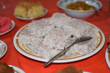 The milk rice on a white plat. Milk rice is a traditional Sri Lankan food made from rice and coconut milk which is used to be a main food on any cultural ceremony or occasion. new year kiribath