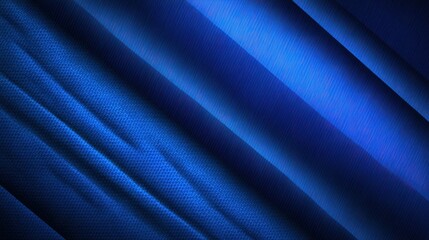 Fototapeta premium Deep blue fabric drapes in diagonal folds.