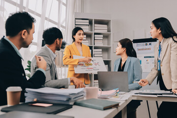 Team of financial advisory services. Asian advisor showing plan of investment to clients in the consultancy office..