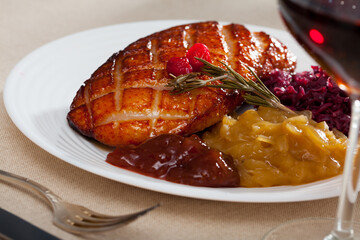 Delicious poultry dish - duck breast Magret with pickled cabbage, herbs and rosemary