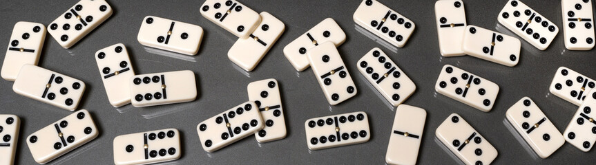 domino pieces on the table in full screen panorama format