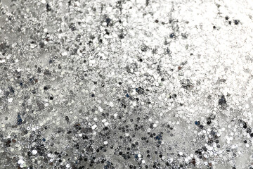 Texture of silver glitter as background, closeup