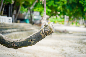 the wooden swing on the beach with dramatic tone
