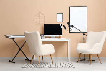 Interior of recording studio with workplace, microphone and synthesizer