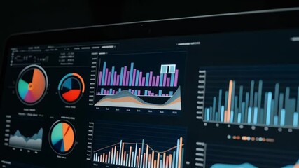 Laptop screen displaying various data charts and graphs for business analysis and financial reporting - Powered by Adobe