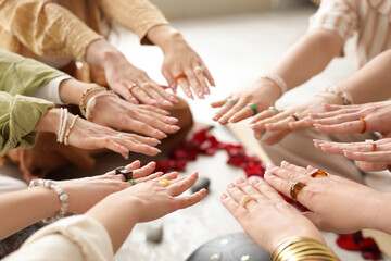 Group of young girls putting hands together during women circle training, closeup