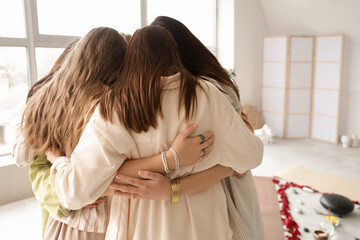 Group of young girls hugging during women circle training