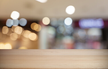 Empty wood table top and blur of restaurant background selective focus product display
