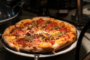 Tasty Italian pizza with a lot of toppings.