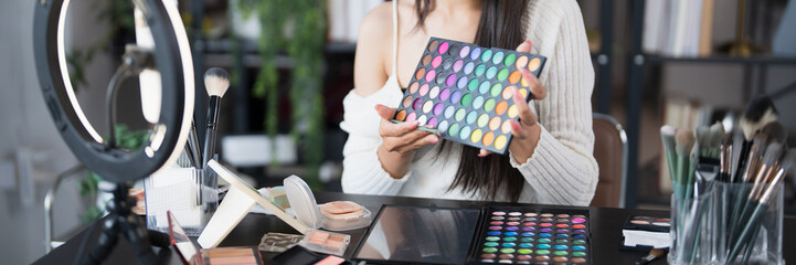 beauty blogger Young Asian girl makeup artist Professional Woman blogger vlogger is showing...
