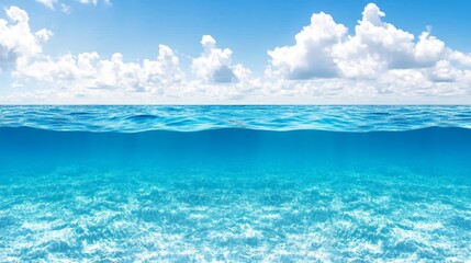 Serene Ocean Waters Under a Blue Sky with Fluffy White Clouds