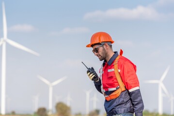 Male man engineer inspection posing check control wind power machine in out door wind energy...