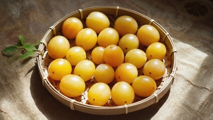 Basket of yellow plums on burlap, bathed in light, shows freshness and natural texture
