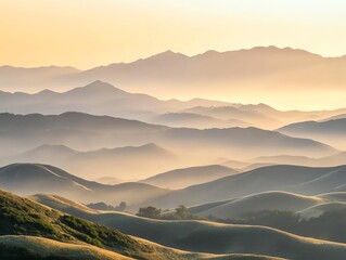 Vast mountain landscape at dawn with rolling hills fading into the distance soft morning light and gentle mist create a tranquil and expansive view