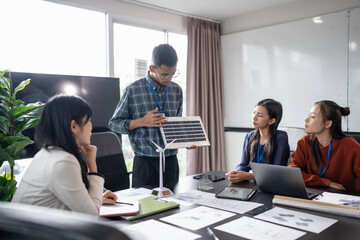 Solar panels green energy Business people working in green eco friendly office business meeting...