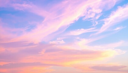 Obraz premium A breathtaking sky painted in soft pink and vibrant blue hues, with wispy clouds gently blending the colors, creating a serene and dreamy atmosphere.