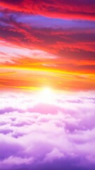Obraz premium A breathtaking sunset casts vibrant hues of orange, pink, and purple across fluffy clouds, creating a stunning, serene sky that inspires tranquility.