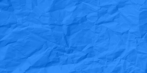 Closeup of blue crumpled paper for texture background.  Sheet of printer paper wrinkled background.