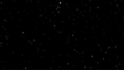 Real falling snow on a black background for use as a texture layer in a photo design. 
