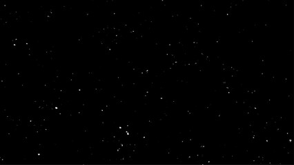 Real falling snow on a black background for use as a texture layer in a photo design. Snowstorm on a black background. 