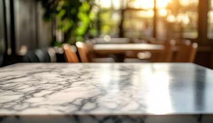 Obraz premium Empty cafe table, marble top, sunlight through windows. Blurred background shows cafe interior with tables and chairs
