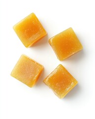 Four square, golden-yellow hard candies
